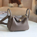 Hermes mini lindy TC 20 elephant gray gold buckle